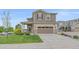 Charming two-story home with a well-manicured lawn, inviting curb appeal, and a two-car garage at 23831 Eagle Bend Ln, Parker, CO 80138