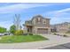 Charming two-story home with a well-manicured lawn, inviting curb appeal, and a two-car garage at 23831 Eagle Bend Ln, Parker, CO 80138