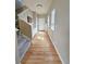 Bright entry hallway with hardwood floors, leading to the home's main living spaces at 23831 Eagle Bend Ln, Parker, CO 80138