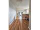 Upstairs hallway featuring hardwood floors and a view into the living room at 23831 Eagle Bend Ln, Parker, CO 80138