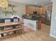 Open kitchen featuring an island, granite countertops, stainless appliances, and wood cabinetry at 23831 Eagle Bend Ln, Parker, CO 80138