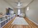 Bright living room with a large window, shelving and a comfortable seating area at 23831 Eagle Bend Ln, Parker, CO 80138