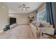 Comfortable living room with a fireplace, a large sofa, and a media center for entertainment at 23831 Eagle Bend Ln, Parker, CO 80138