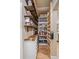 Walk-in pantry has wood countertops, drawers, open shelving, and offers ample storage for kitchen essentials at 23831 Eagle Bend Ln, Parker, CO 80138