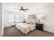 Bedroom featuring neutral decor, carpet, and two windows at 2826 Quitman St, Denver, CO 80212