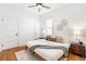 Bright bedroom features hardwood floors, ceiling fan, and neutral decor at 2826 Quitman St, Denver, CO 80212