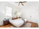 Bright bedroom features hardwood floors, ceiling fan, and neutral decor at 2826 Quitman St, Denver, CO 80212