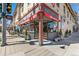 Street view of the Mondo Vino wine shop with outdoor seating and awning at 2826 Quitman St, Denver, CO 80212