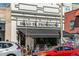 A view of Mead St Provisions with a black awning and various vehicles parked in front at 2826 Quitman St, Denver, CO 80212
