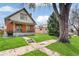 Beautiful home with a lush green lawn and sidewalk leading to the front entrance at 2826 Quitman St, Denver, CO 80212