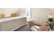 Hallway area with desk space, yellow chairs, and neutral decor at 2826 Quitman St, Denver, CO 80212