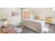 Hallway area with desk space, yellow chairs, and neutral decor at 2826 Quitman St, Denver, CO 80212