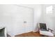 Hallway with large closet with bi-fold doors and a chair at 2826 Quitman St, Denver, CO 80212