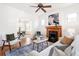 Cozy living room with a fireplace, hardwood floors, and a comfortable seating area at 2826 Quitman St, Denver, CO 80212