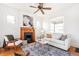 Inviting living room featuring a fireplace, hardwood floors, and comfortable furniture at 2826 Quitman St, Denver, CO 80212