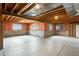 Unfinished basement featuring concrete floor, exposed ceiling, and three windows at 2366 Shoreside Dr, Berthoud, CO 80513