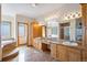 Spacious bathroom with double sinks, granite counters, a bathtub, and a separate shower at 2366 Shoreside Dr, Berthoud, CO 80513