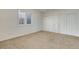 Bright, carpeted bedroom with window and double closets at 2366 Shoreside Dr, Berthoud, CO 80513