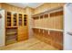 Walk-in closet with wood paneling, custom shelving, and built-in storage at 2366 Shoreside Dr, Berthoud, CO 80513