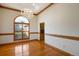 Dining room features wood trim, arched windows with shutters, and an elegant chandelier at 2366 Shoreside Dr, Berthoud, CO 80513