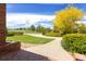 A wide paved walkway from the front door to the driveway creates a visually interesting front yard at 2366 Shoreside Dr, Berthoud, CO 80513