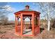 Well-maintained red gazebo in a serene landscape setting at 2366 Shoreside Dr, Berthoud, CO 80513