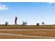 Golfer tees off on a sunny day with equipment nearby at 2366 Shoreside Dr, Berthoud, CO 80513