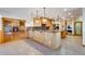 Spacious kitchen with a large island, stone countertops, and ample cabinet space at 2366 Shoreside Dr, Berthoud, CO 80513