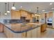 Large kitchen with a central island, granite countertops, and pendant lighting at 2366 Shoreside Dr, Berthoud, CO 80513