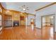 Cozy living room with hardwood floors, built-in cabinets, shelving and a fireplace at 2366 Shoreside Dr, Berthoud, CO 80513