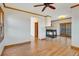 Inviting living room with a fireplace, hardwood floors, and natural light from sliding doors at 2366 Shoreside Dr, Berthoud, CO 80513