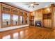 Spacious living room featuring hardwood floors, large windows and a cozy fireplace with built-ins at 2366 Shoreside Dr, Berthoud, CO 80513