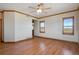 Open living area with hardwood floors, wood trim, and bright, natural light at 2366 Shoreside Dr, Berthoud, CO 80513