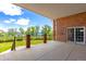Covered brick patio with iron railing offering outdoor living and picturesque views at 2366 Shoreside Dr, Berthoud, CO 80513