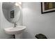 Simple bathroom with pedestal sink and mirror at 4152 Netherland St, Denver, CO 80249