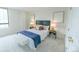 This bedroom features a neutral color palette and comfortable furnishings at 1020 15Th St # 29L, Denver, CO 80202