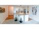 Bright kitchen with white cabinetry, a marble countertop breakfast bar and stainless steel appliances at 1020 15Th St # 29L, Denver, CO 80202