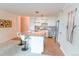 Bright kitchen with white cabinetry, a marble countertop breakfast bar and stainless steel appliances at 1020 15Th St # 29L, Denver, CO 80202