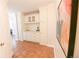Cozy kitchen nook with custom cabinets, granite counters, and tile flooring at 1020 15Th St # 29L, Denver, CO 80202