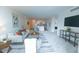 Bright living room featuring an open concept layout connecting living room and kitchen area at 1020 15Th St # 29L, Denver, CO 80202