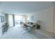 Sun-filled living room with stylish decor, plush seating, and a walk-out balcony at 1020 15Th St # 29L, Denver, CO 80202