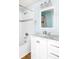 Bathroom featuring a single vanity, a bathtub, and a shower at 7423 S Quail Cir # 1533, Littleton, CO 80127
