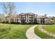 Attractive multi-story condo building with well-maintained landscaping and inviting walkway at 7423 S Quail Cir # 1533, Littleton, CO 80127