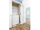 Laundry closet featuring a stacked washer and dryer and wire shelving at 7423 S Quail Cir # 1533, Littleton, CO 80127
