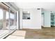 Spacious living area with balcony access, open layout, and stylish flooring at 7423 S Quail Cir # 1533, Littleton, CO 80127