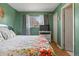 Bright bedroom featuring colorful floral bedding and natural light, creating a cheerful ambiance at 9410 Cedar Ct, Thornton, CO 80229
