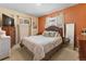 Comfortable bedroom with plush bedding, wood furniture, and abundant natural light at 9410 Cedar Ct, Thornton, CO 80229