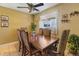 Well-lit dining room featuring tile floors, and a traditional wooden dining table at 9410 Cedar Ct, Thornton, CO 80229