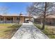 Spacious driveway with covered parking and a basketball hoop, perfect for outdoor activities at 9410 Cedar Ct, Thornton, CO 80229