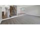Bright basement with a staircase, plush carpet and updated flooring with recessed lights at 7746 S Harrison Cir, Centennial, CO 80122
